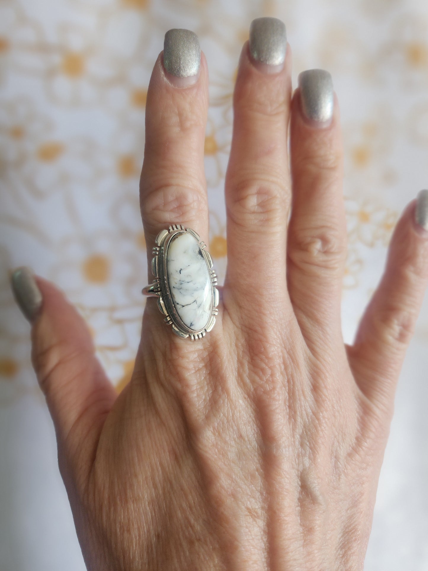 White Buffalo Oval Ring with Sawtooth Accent
