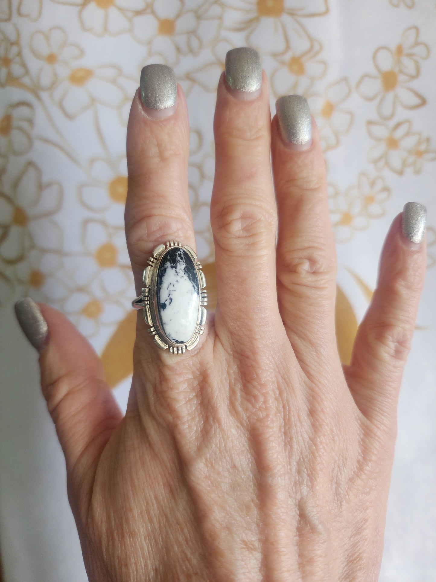 White Buffalo Oval Ring with Sawtooth Accent