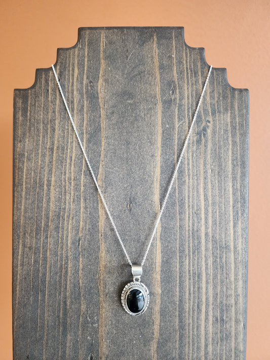 Oval Black Onyx Pendant Necklace with Sawtooth accent