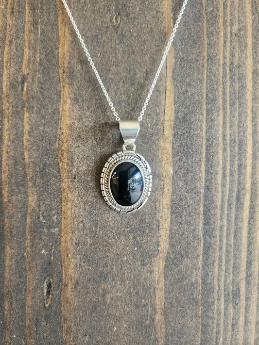 Oval Black Onyx Pendant Necklace with Sawtooth accent