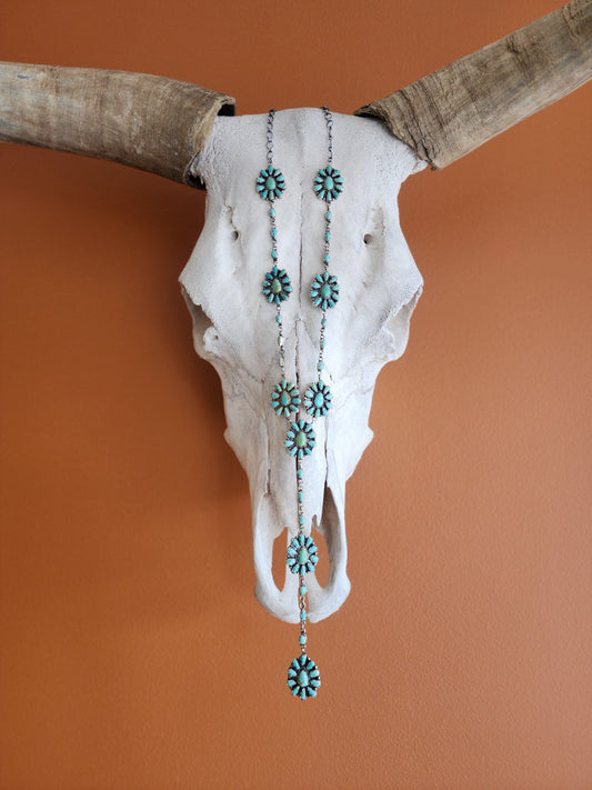 Tyrone Turquoise mult-cluster lariat necklace on steer skull