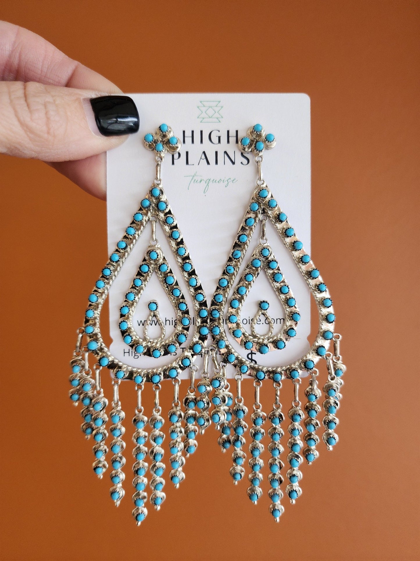 a pair of turquoise chandelier earrings